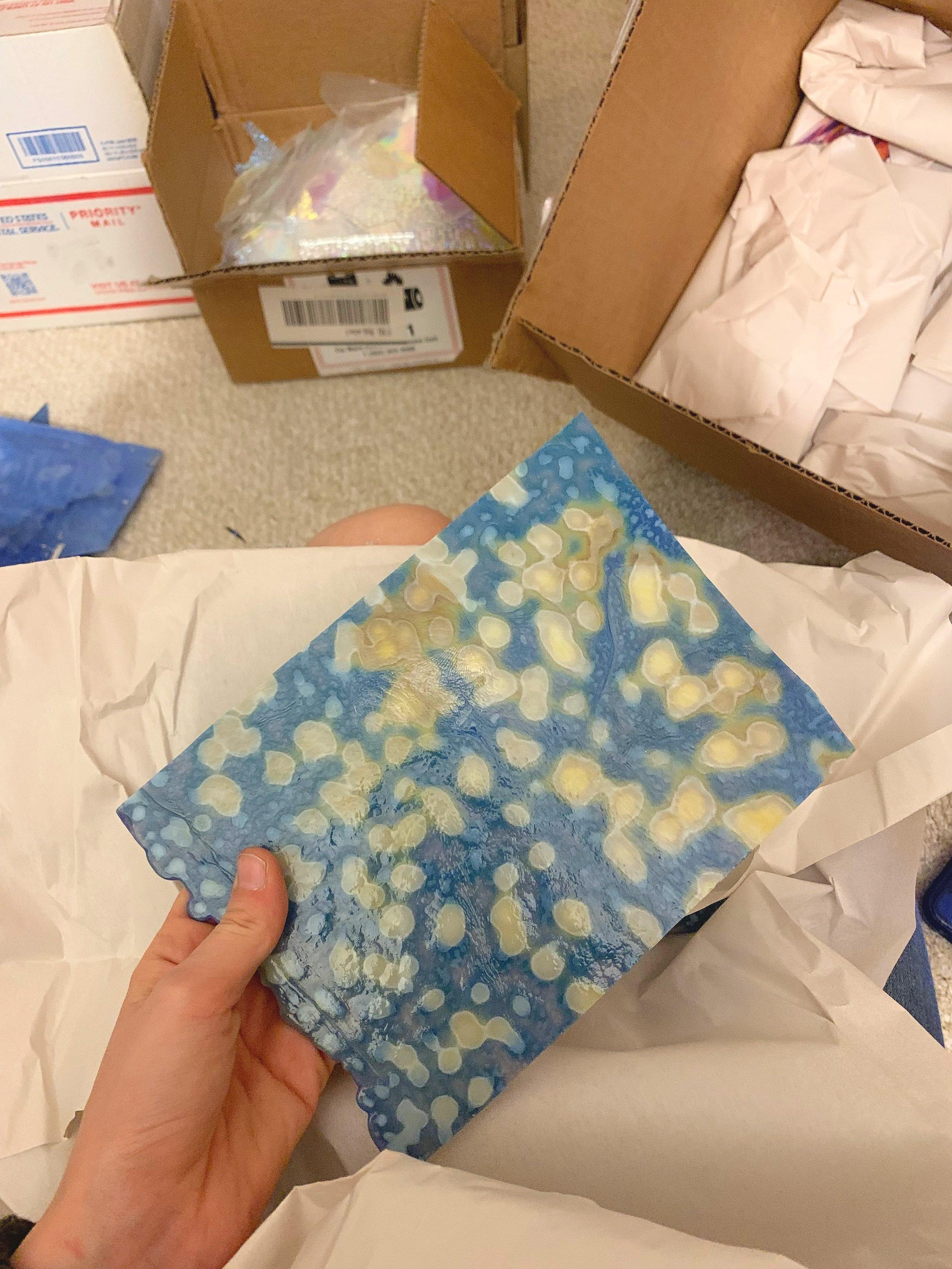 Image of someone packing stained glass for a move