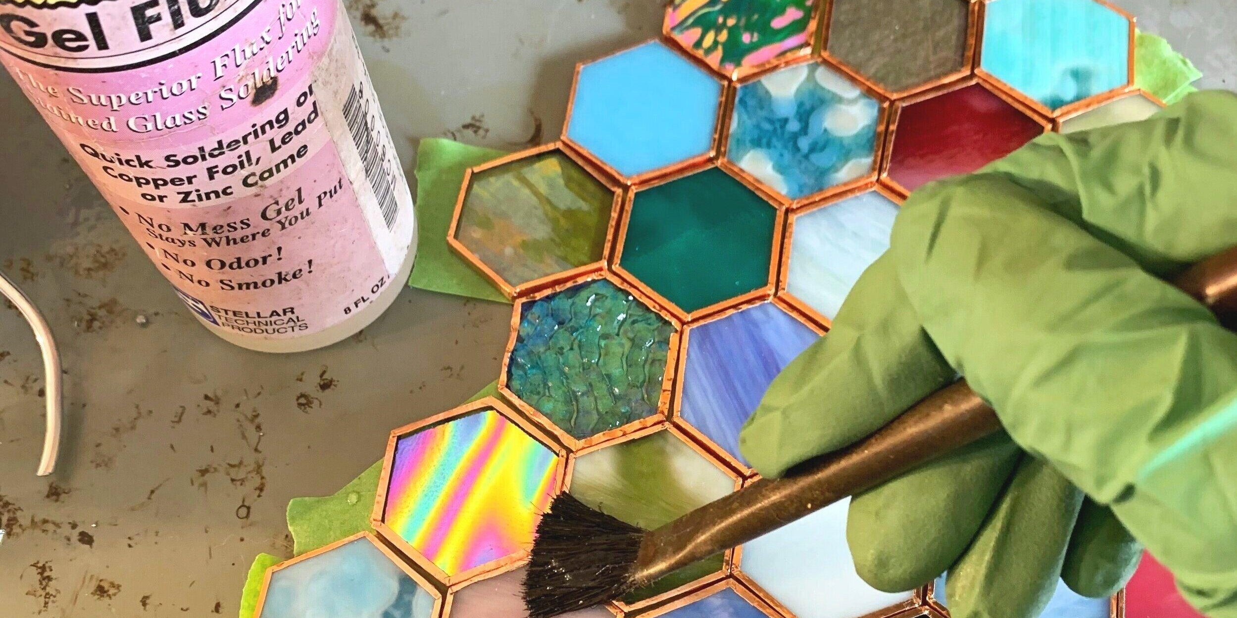 Stained glass soldering on a piece 