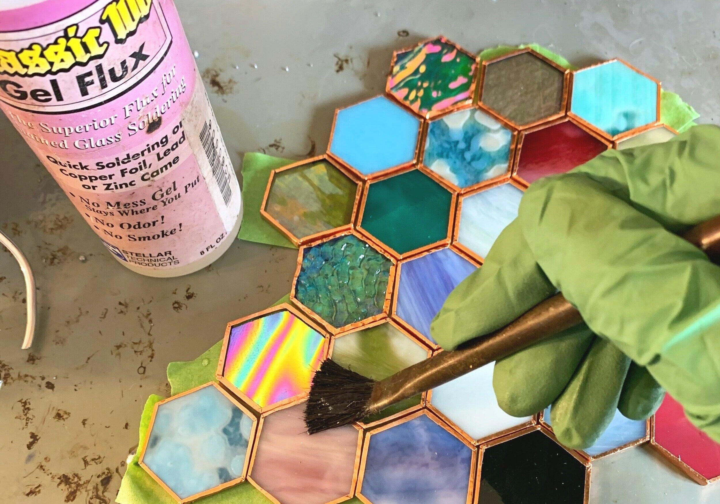 Stained glass soldering on a piece 