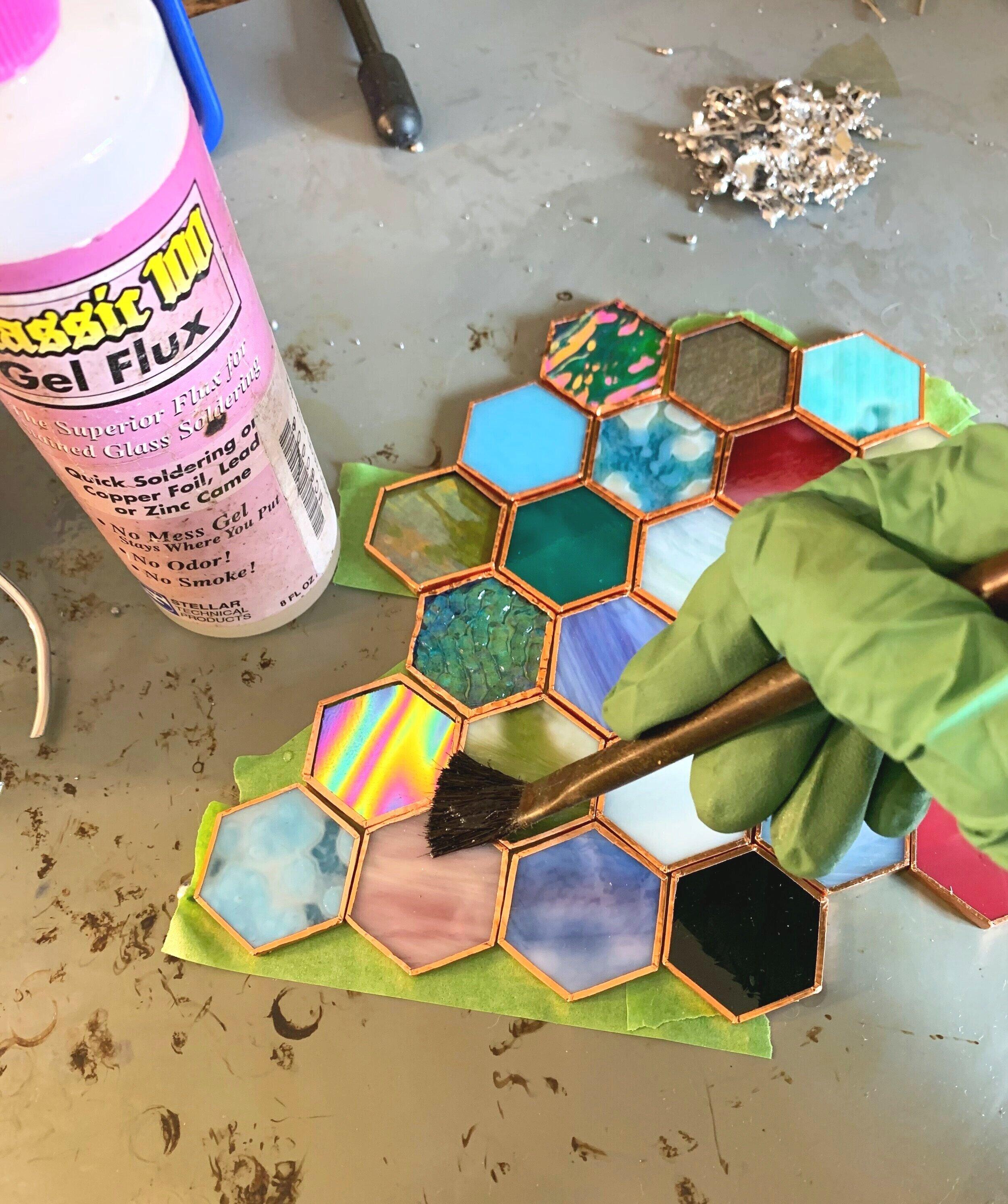 Stained glass soldering on a piece 