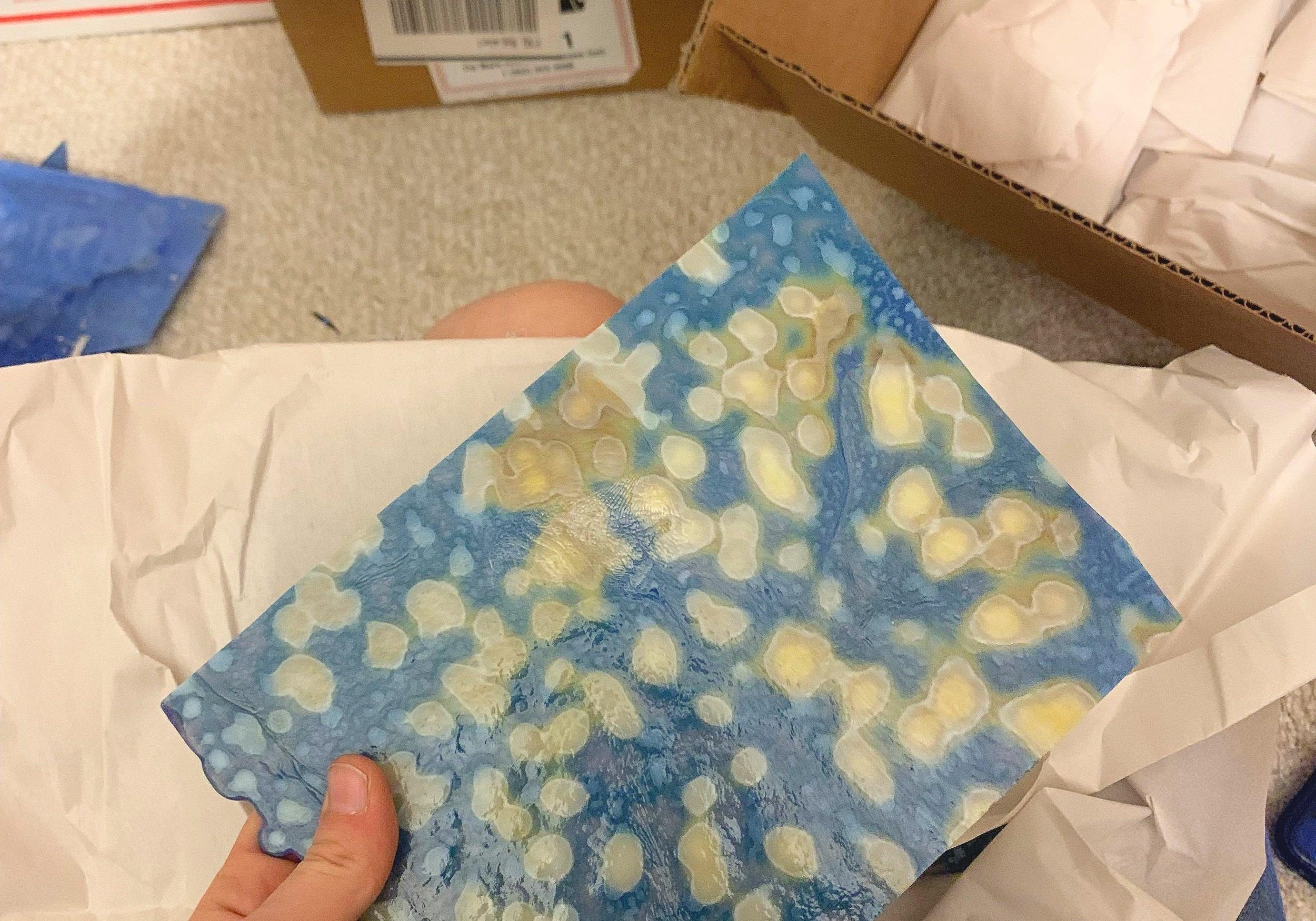 Image of someone packing stained glass for a move