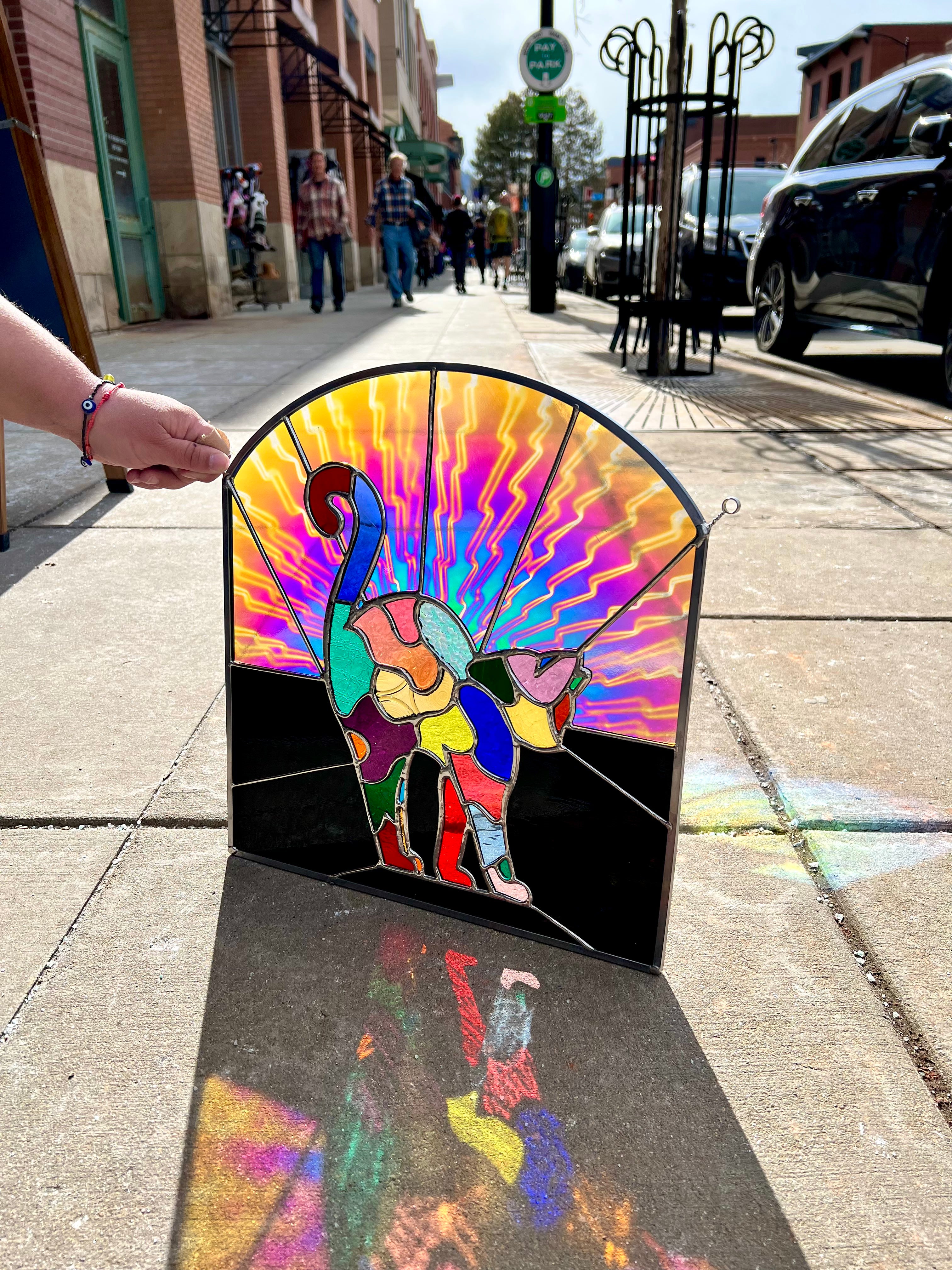 Stained glass cat with several colors 