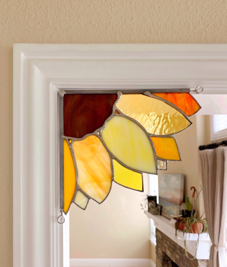 Stained glass sunflower in doorframe 