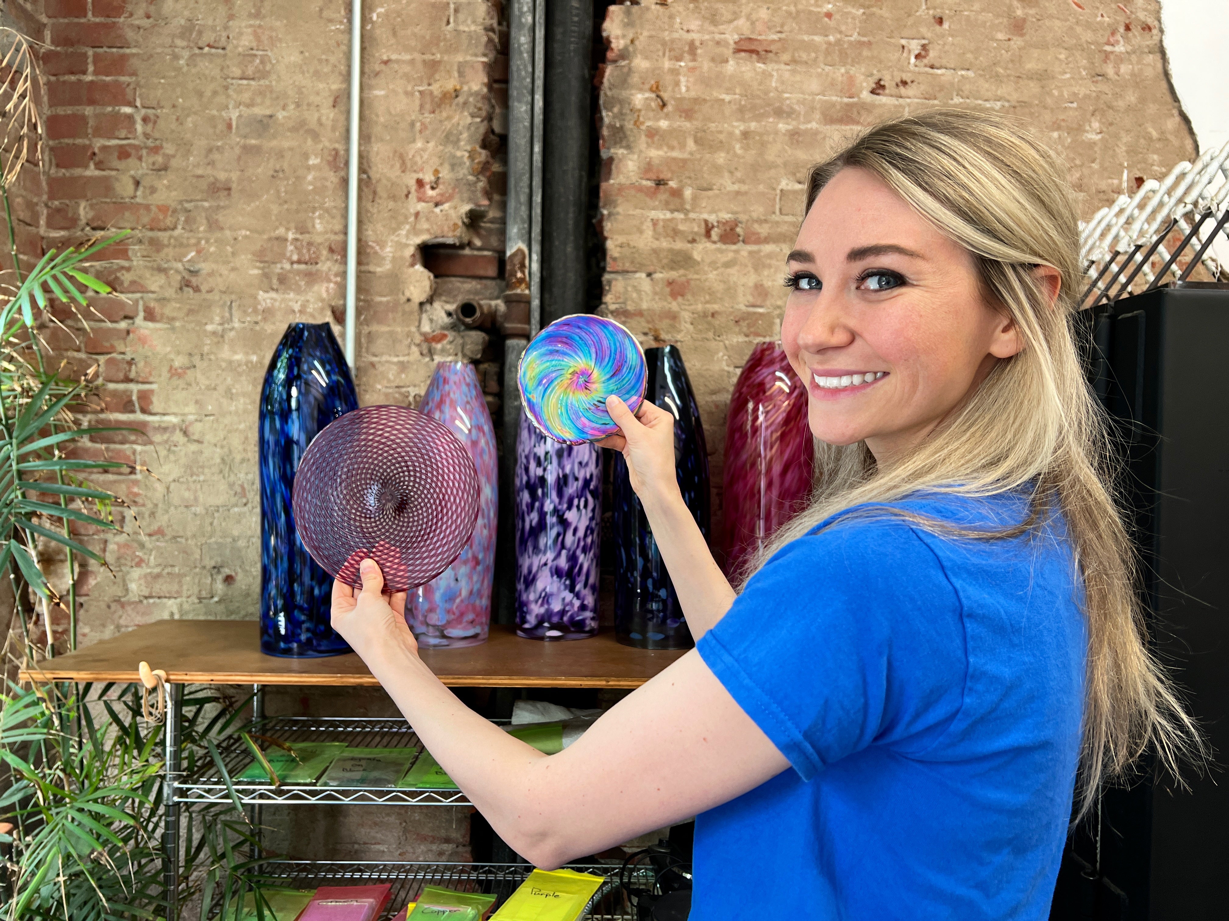 Picture of owner holding stained glass  rondels in hands