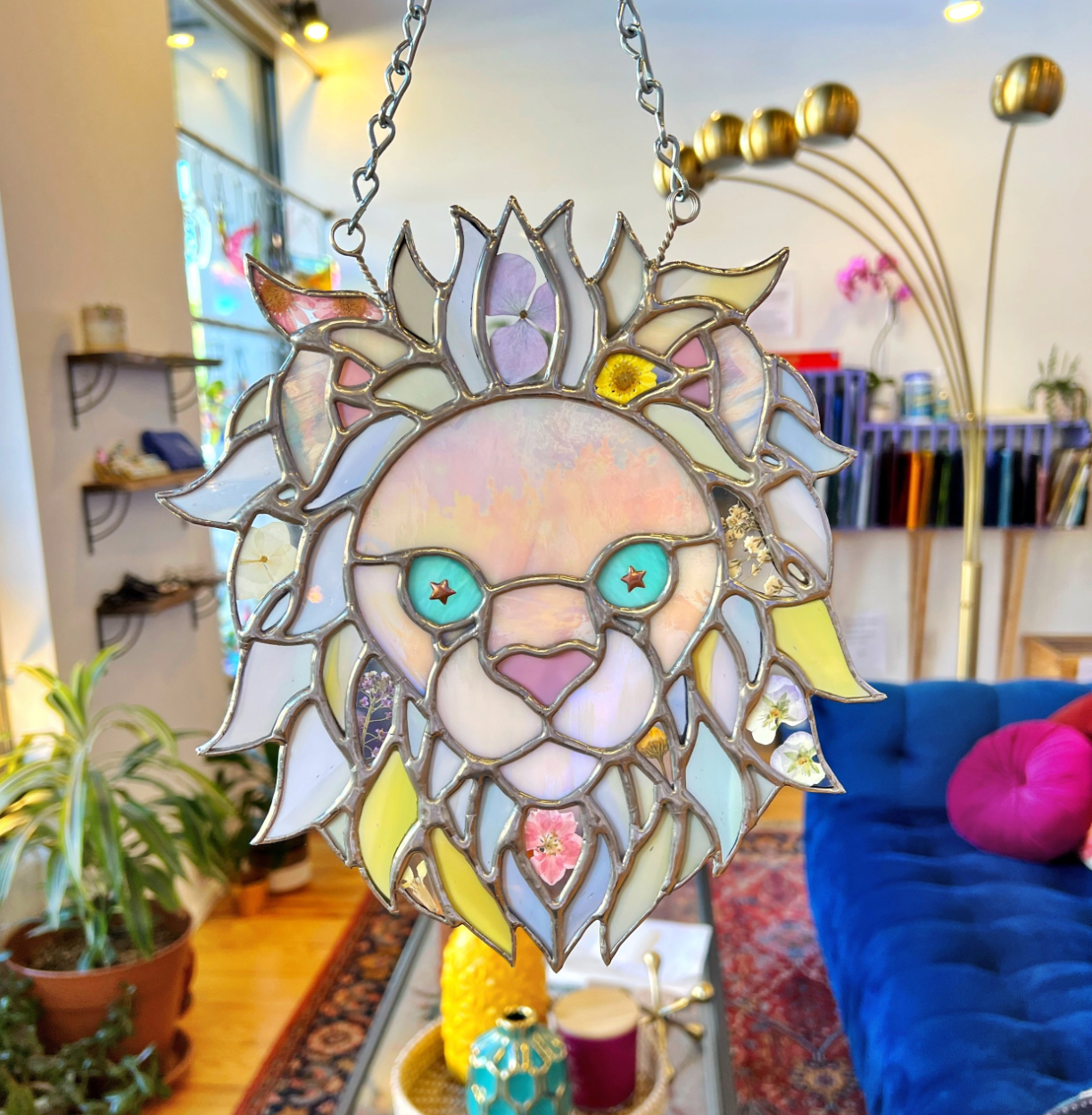 stained glass lion with several pastel colors