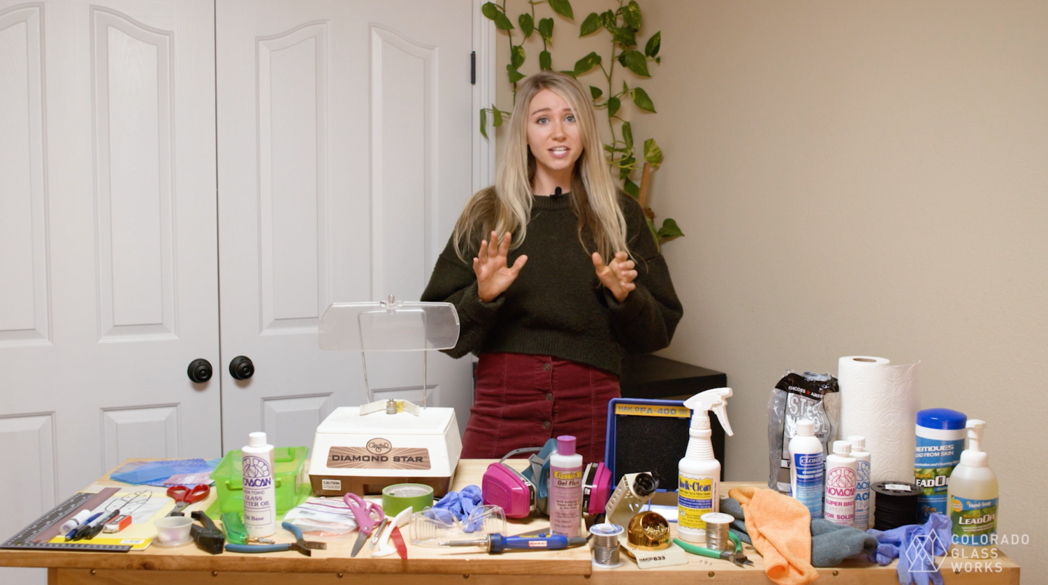 Photo of founder Meggy teaching the stained glass class 